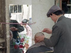 14 Kashgar Old City Street Scene 1993 Getting A Shaved Haircut.jpg